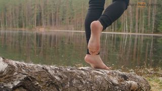 A Girl In Nature Took Off Her Boots And Shows Her Bare Feet-2