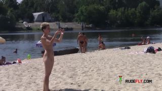 Teen nudists get naked and heat up a public beach teen -1