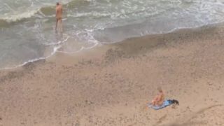 Older guy fucks a teen girl on a beach Voyeur-9