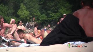 Naughty youthful naturists play with each other in sand  6-5