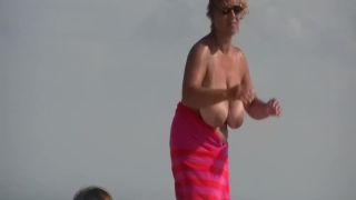 Gigantic mature tits on a beach Nudism-3