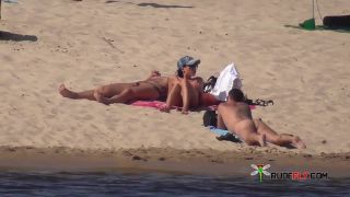 Shy teen pops her top off for all the beach goers  3-7