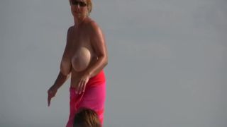 Gigantic mature tits on a beach-5