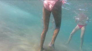 Hot teens playing ball in the ocean-0