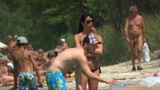 Topless milf with a much younger boyfriend at the beach-4