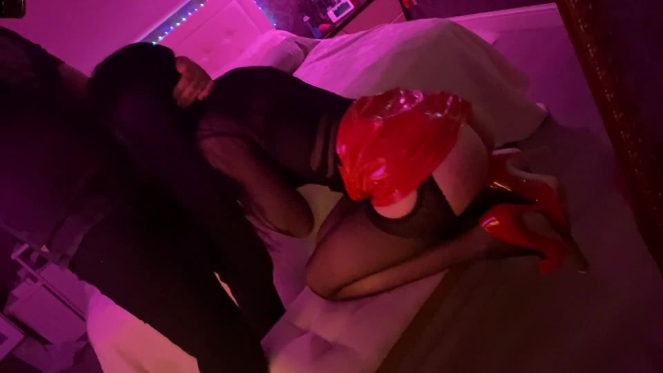 Flying Into Space From Her Red Latex Miniskirt