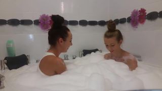 54281 Twin sisters having fun in a bathtub.-2