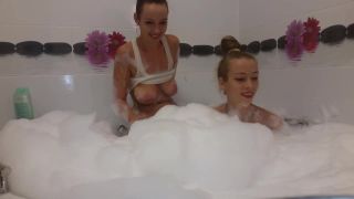54281 Twin sisters having fun in a bathtub.-5