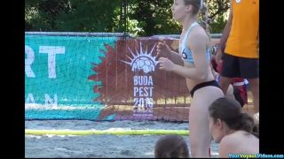 Sporty chicks playing beach handball-5