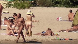 Nymph naturists get naked and heat up a public  strand-7