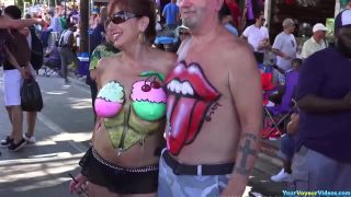 Busty gals showing painted tits-0