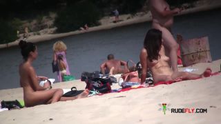 Beautiful fresh faced teen plays at the strand nude  3-9