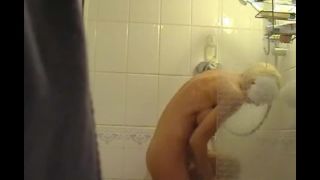 Busty blonde girl fingering pussy in the shower. hidden cam-0